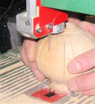 Cutting the slots in the side of the pomander